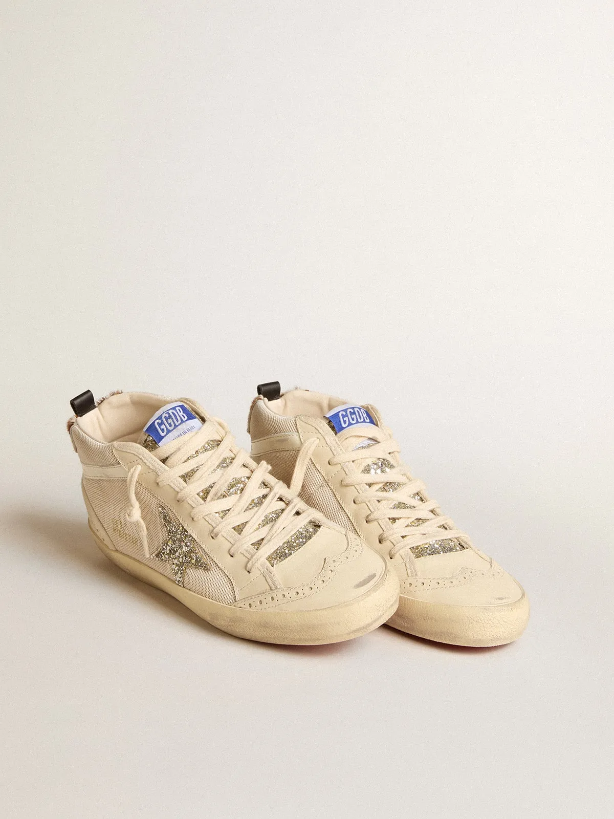 Mid Star femme en résille avec étoile à paillettes platine et virgule en cuir blanc | Golden Goose