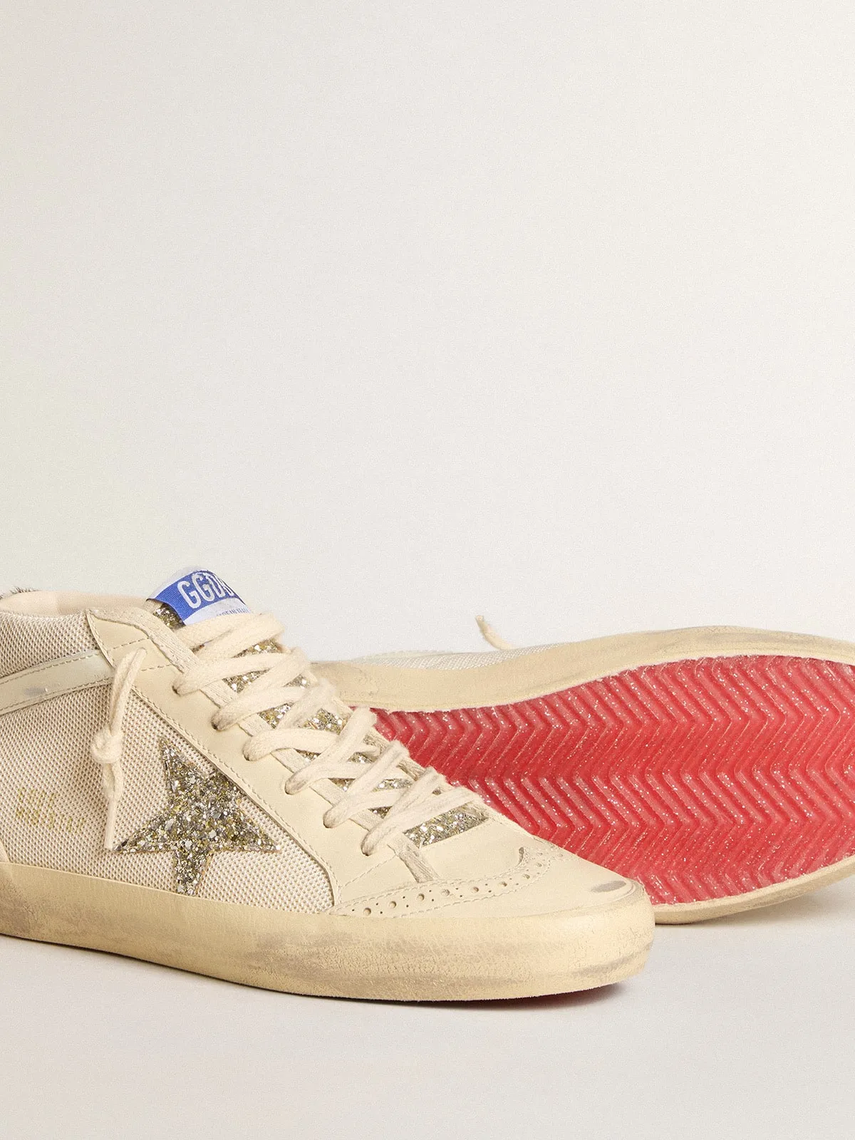 Mid Star femme en résille avec étoile à paillettes platine et virgule en cuir blanc | Golden Goose