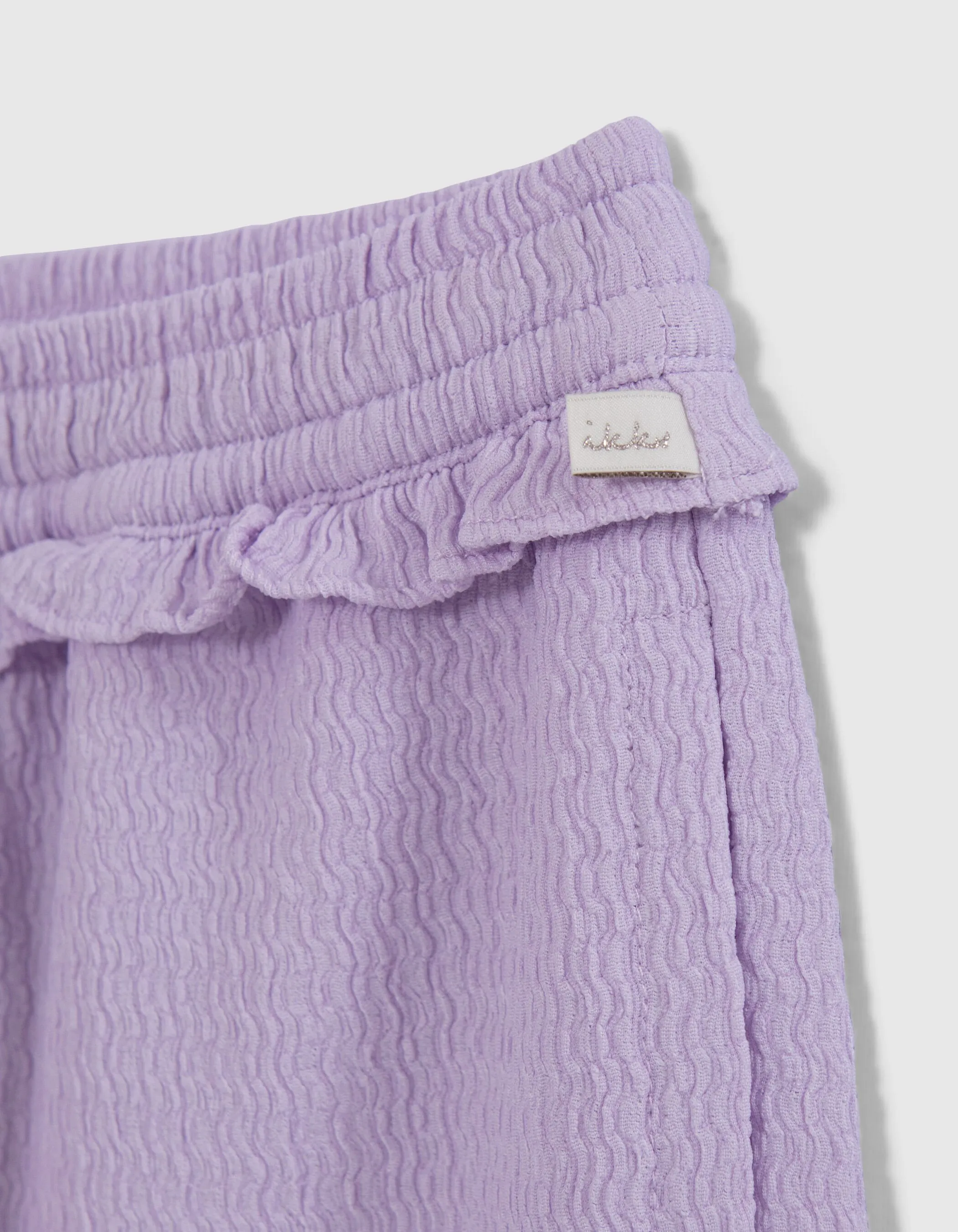 Pantalon large lilas fluide tissu relief fille