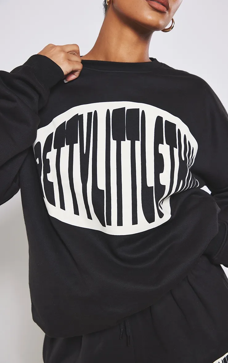 PRETTYLITTLETHING Sweat oversize noir à slogan imprimé