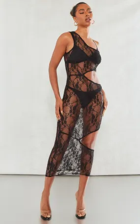 Robe longue asymétrique transparente en dentelle noire à découpes